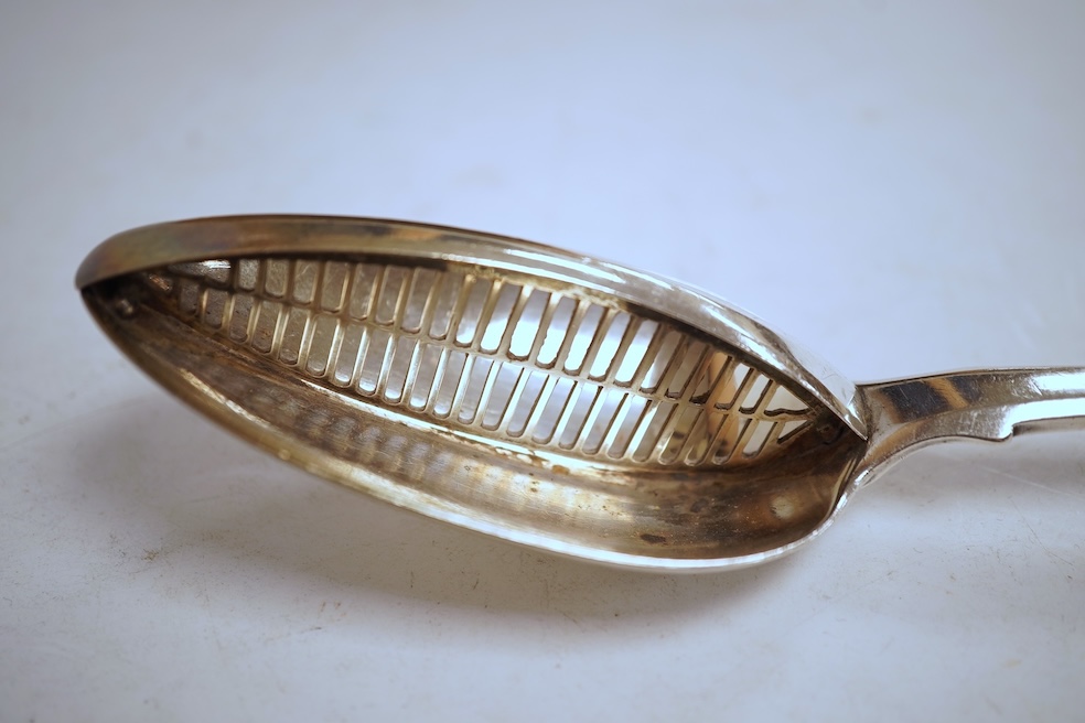 A George III silver fiddle pattern basting/strainer spoon, by Eley & Fearn, London, 1805, 30cm, 5.5oz.